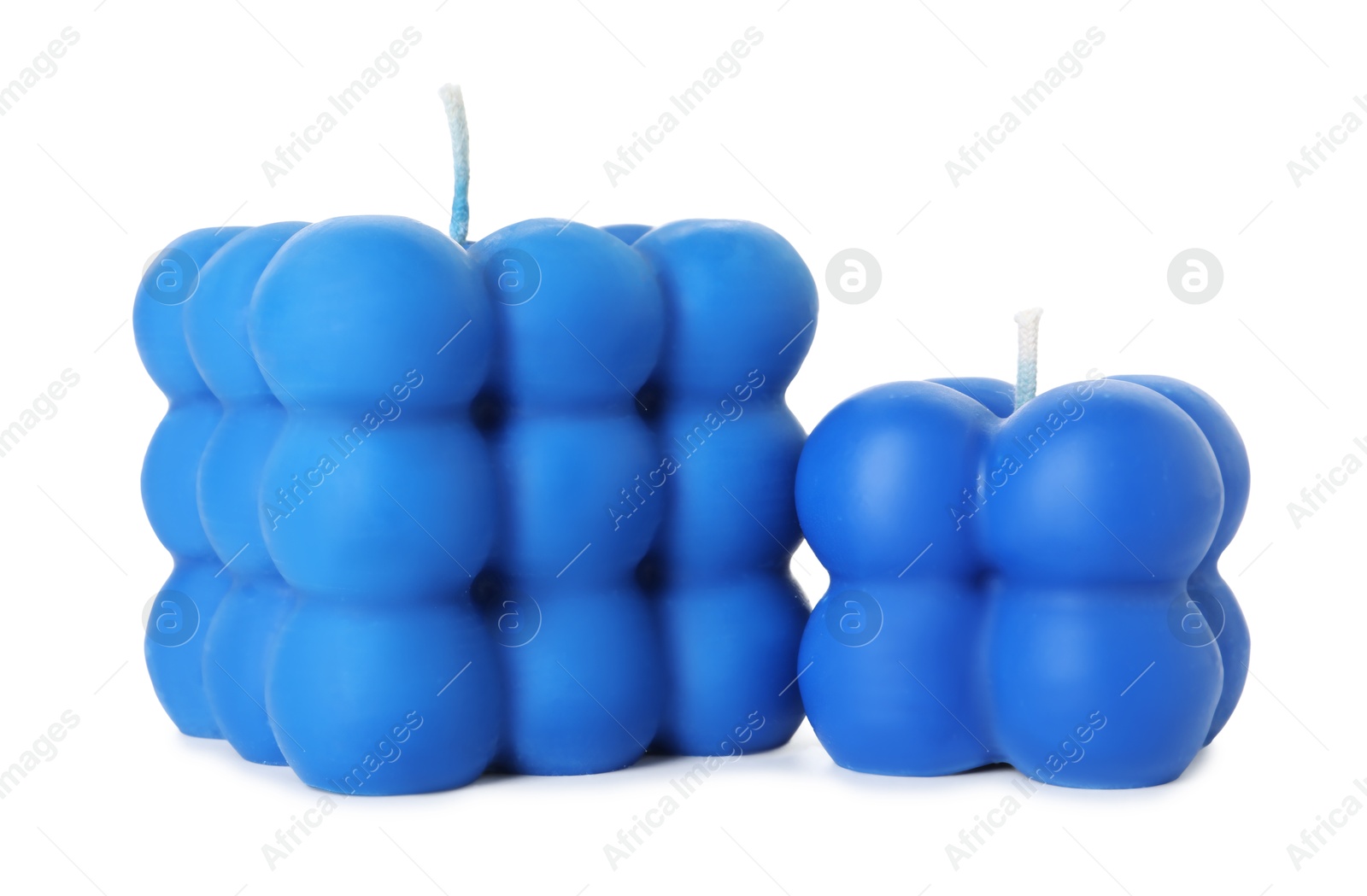 Photo of Two blue bubble candles isolated on white