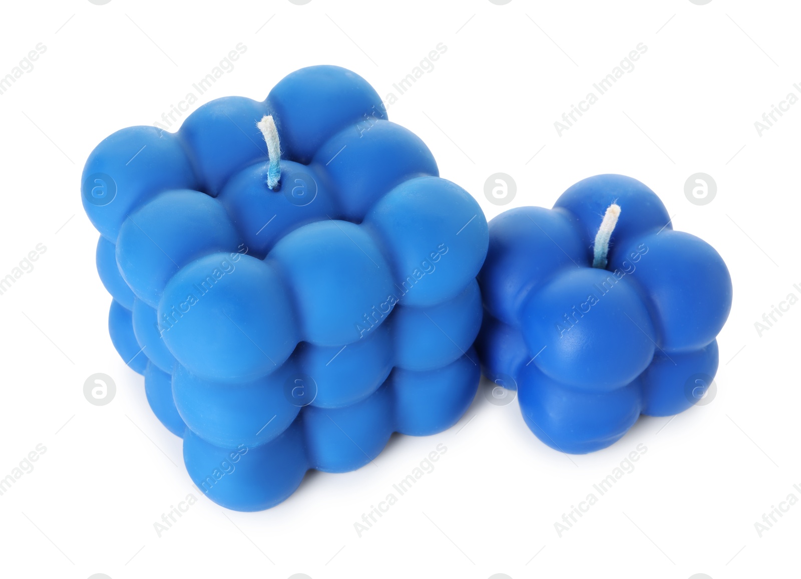 Photo of Two blue bubble candles isolated on white