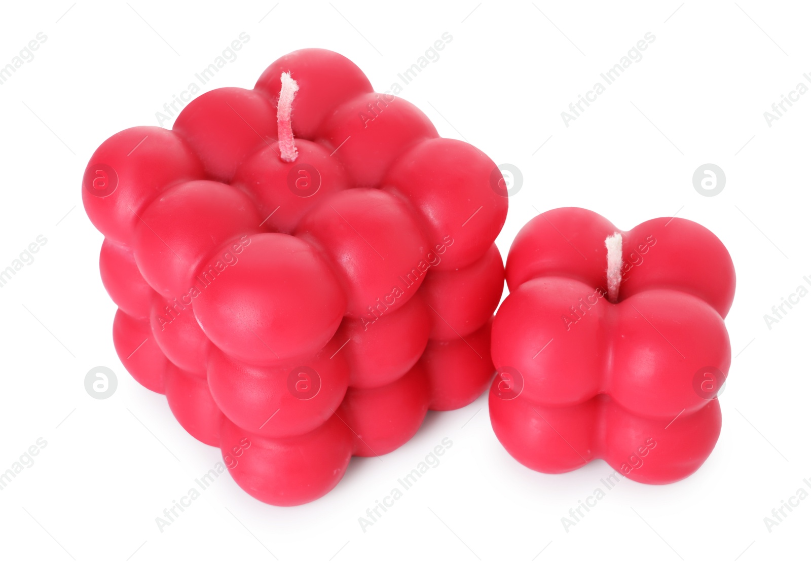 Photo of Two red bubble candles isolated on white