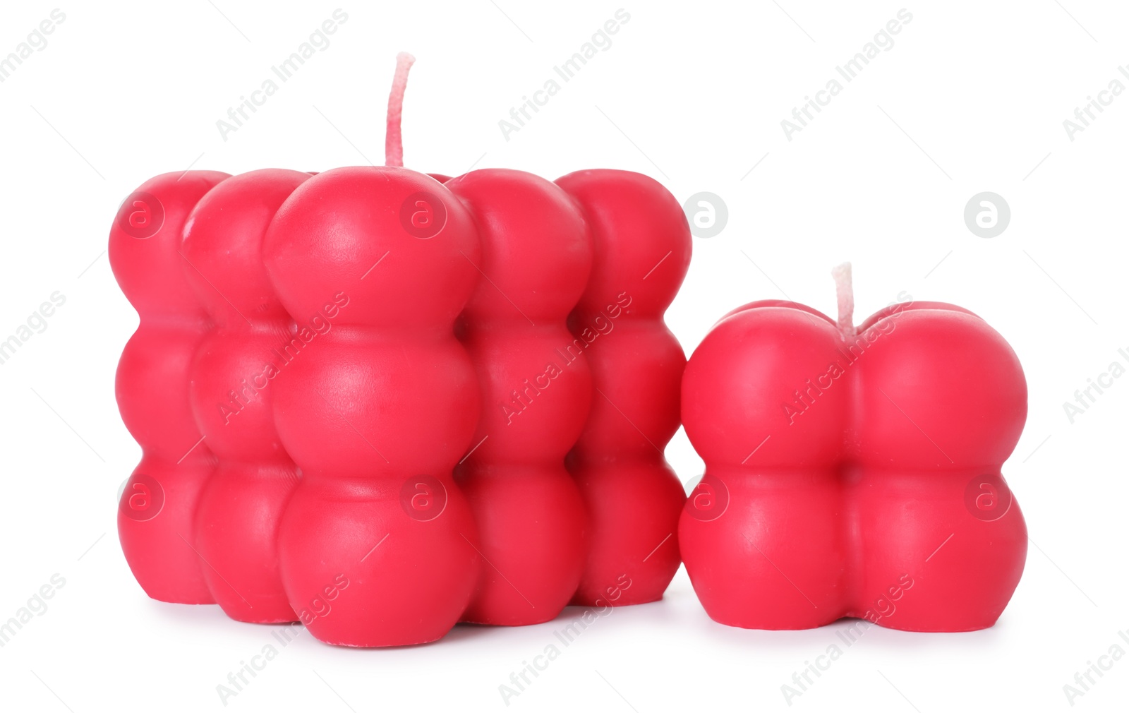 Photo of Two red bubble candles isolated on white