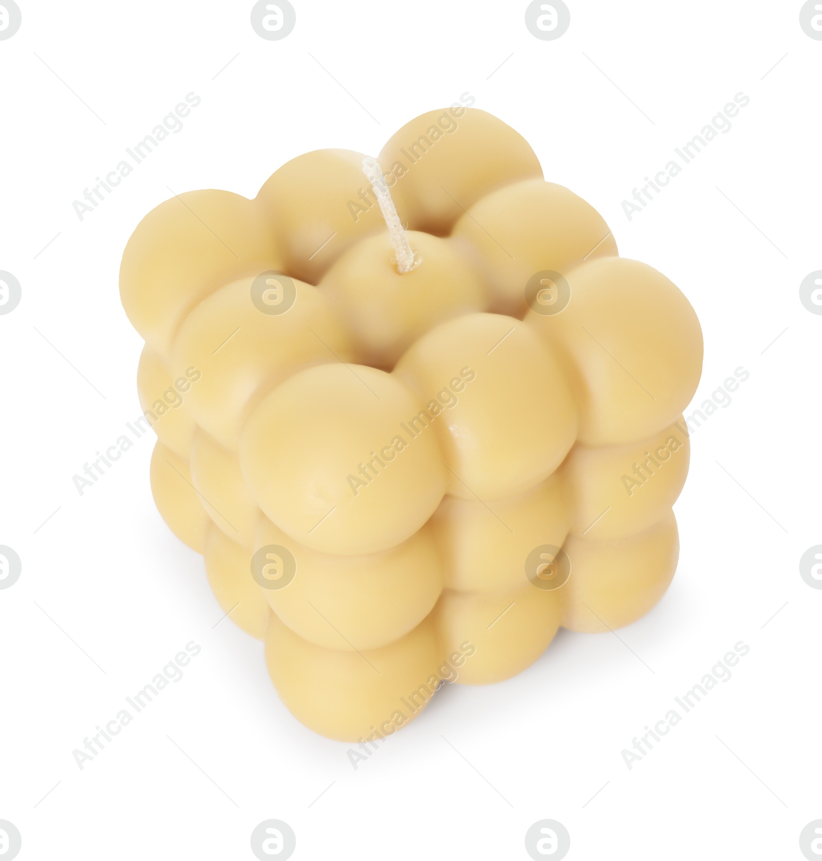 Photo of One beige bubble candle isolated on white