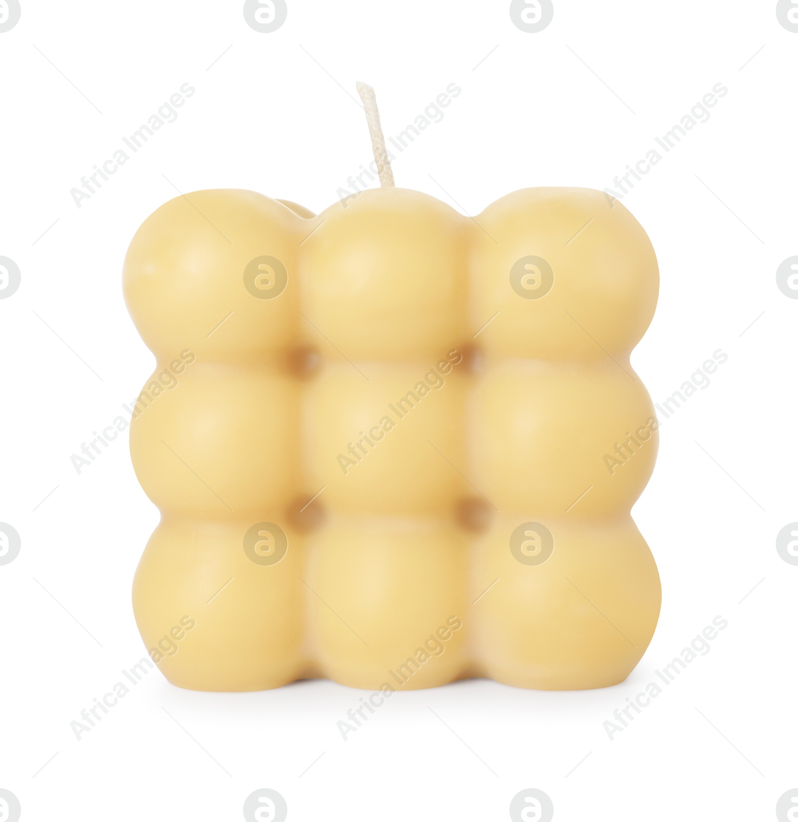 Photo of One beige bubble candle isolated on white