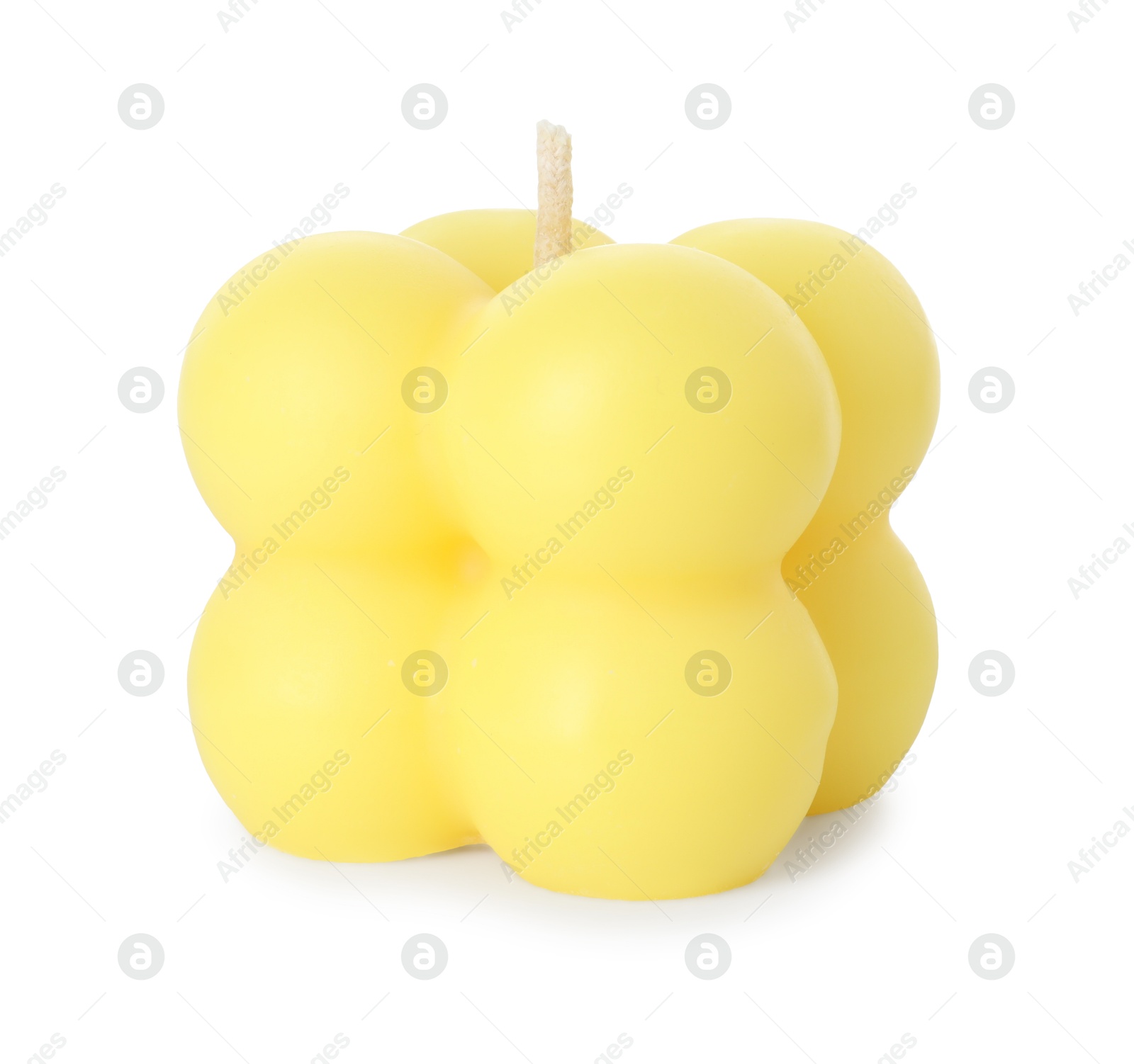 Photo of One yellow bubble candle isolated on white