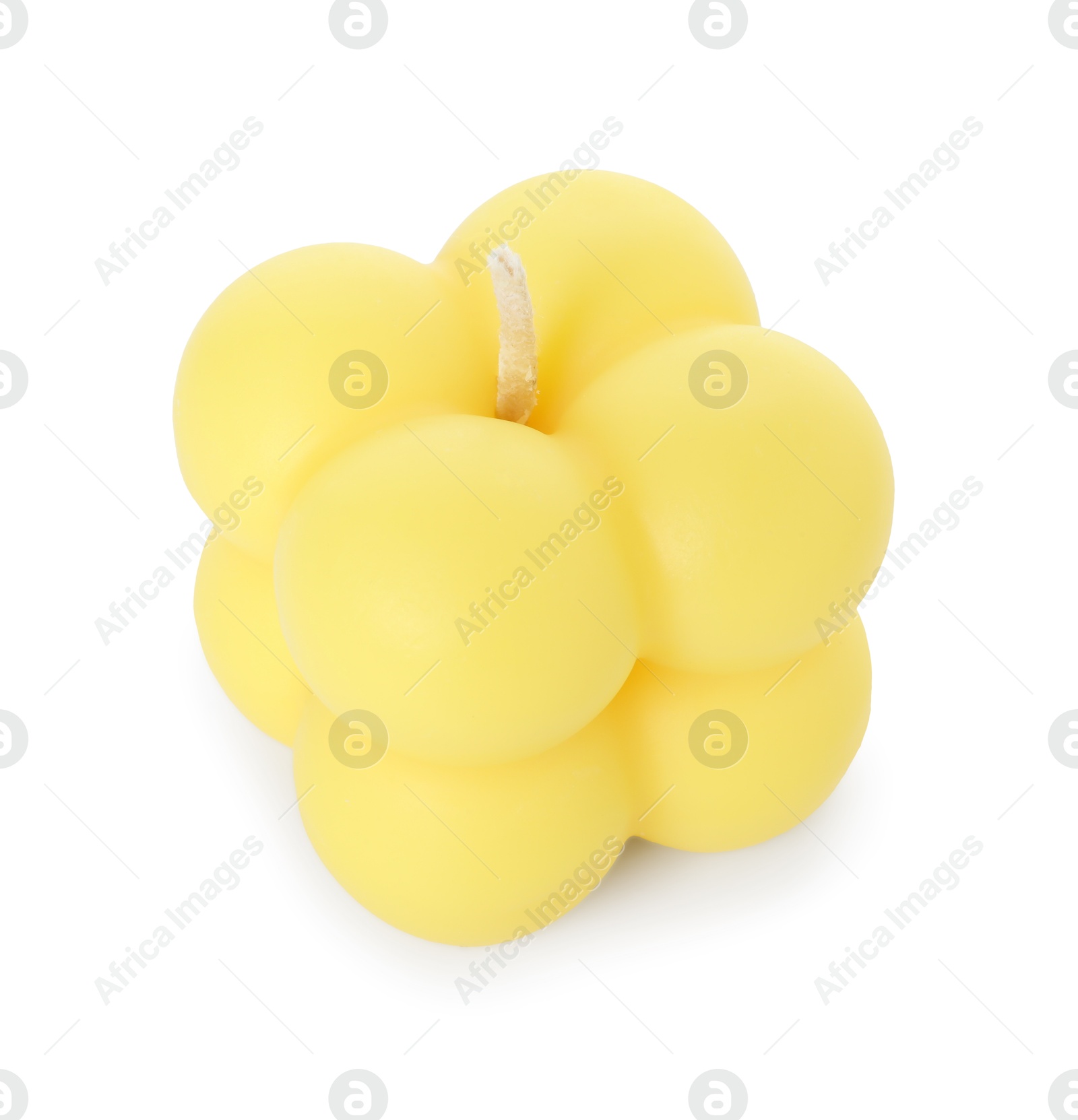 Photo of One yellow bubble candle isolated on white