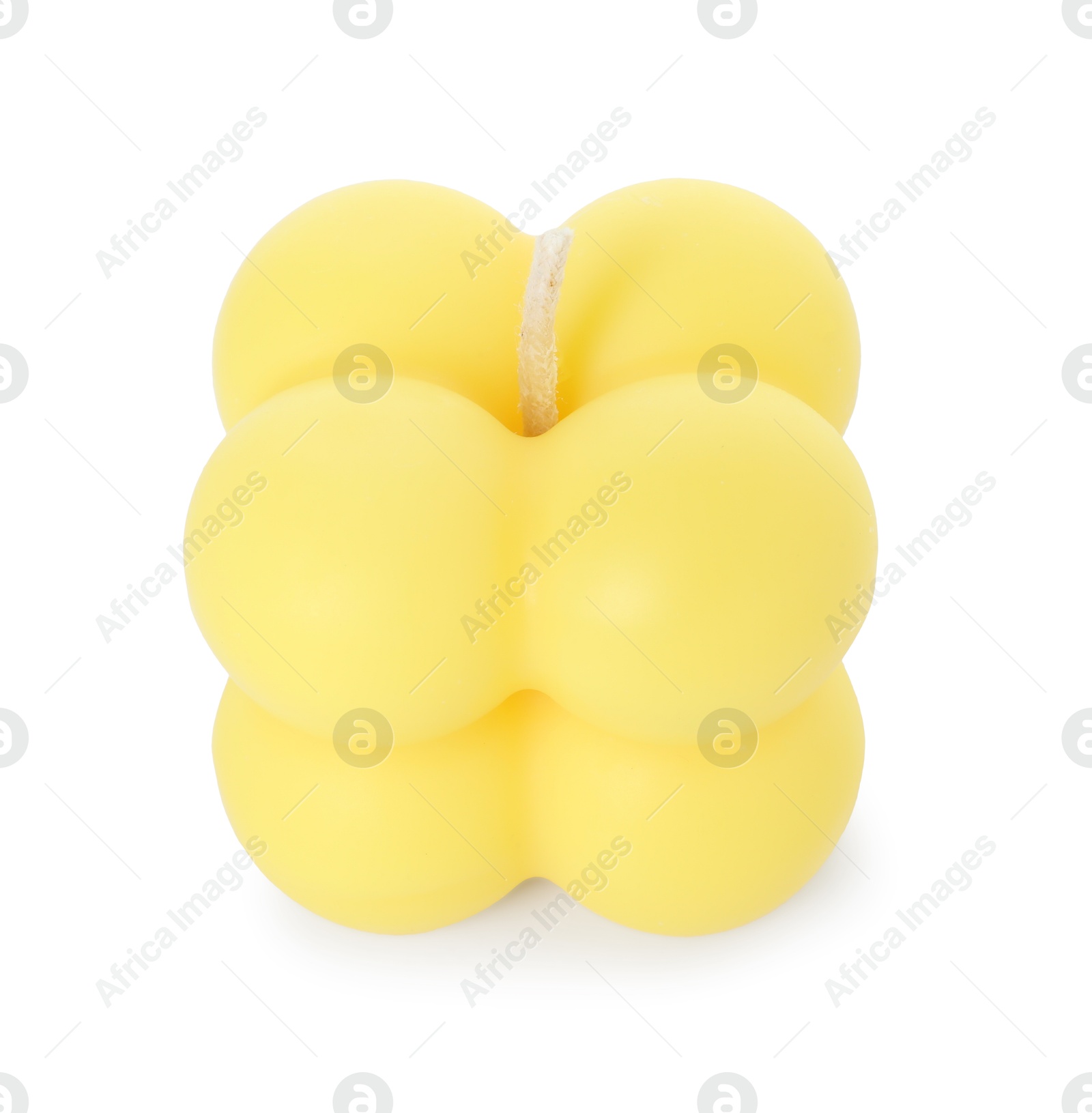 Photo of One yellow bubble candle isolated on white