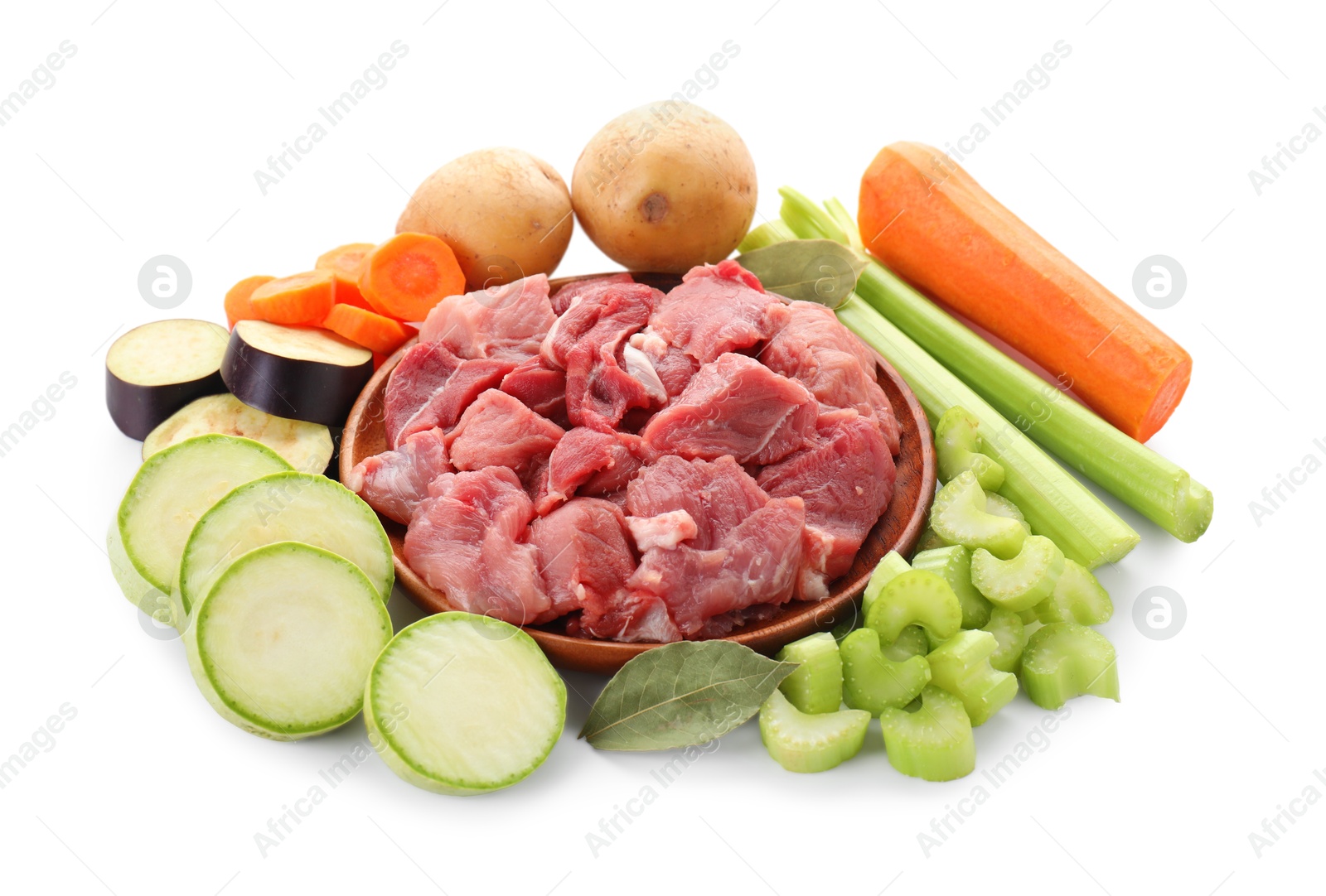 Photo of Cooking stew. Uncooked meat and vegetables isolated on white