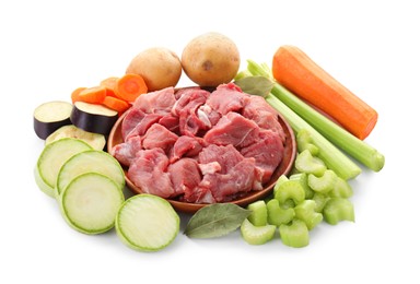 Photo of Cooking stew. Uncooked meat and vegetables isolated on white