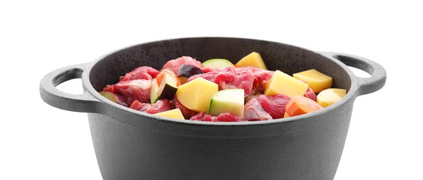 Photo of Cooking stew. Uncooked meat and vegetables in pot isolated on white