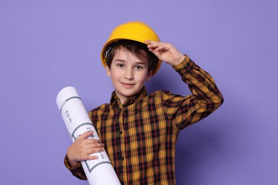 Photo of Boy with house plan pretending to be architect on violet background. Dreaming of future profession