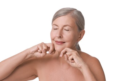 Photo of Beautiful woman doing facial massage on white background