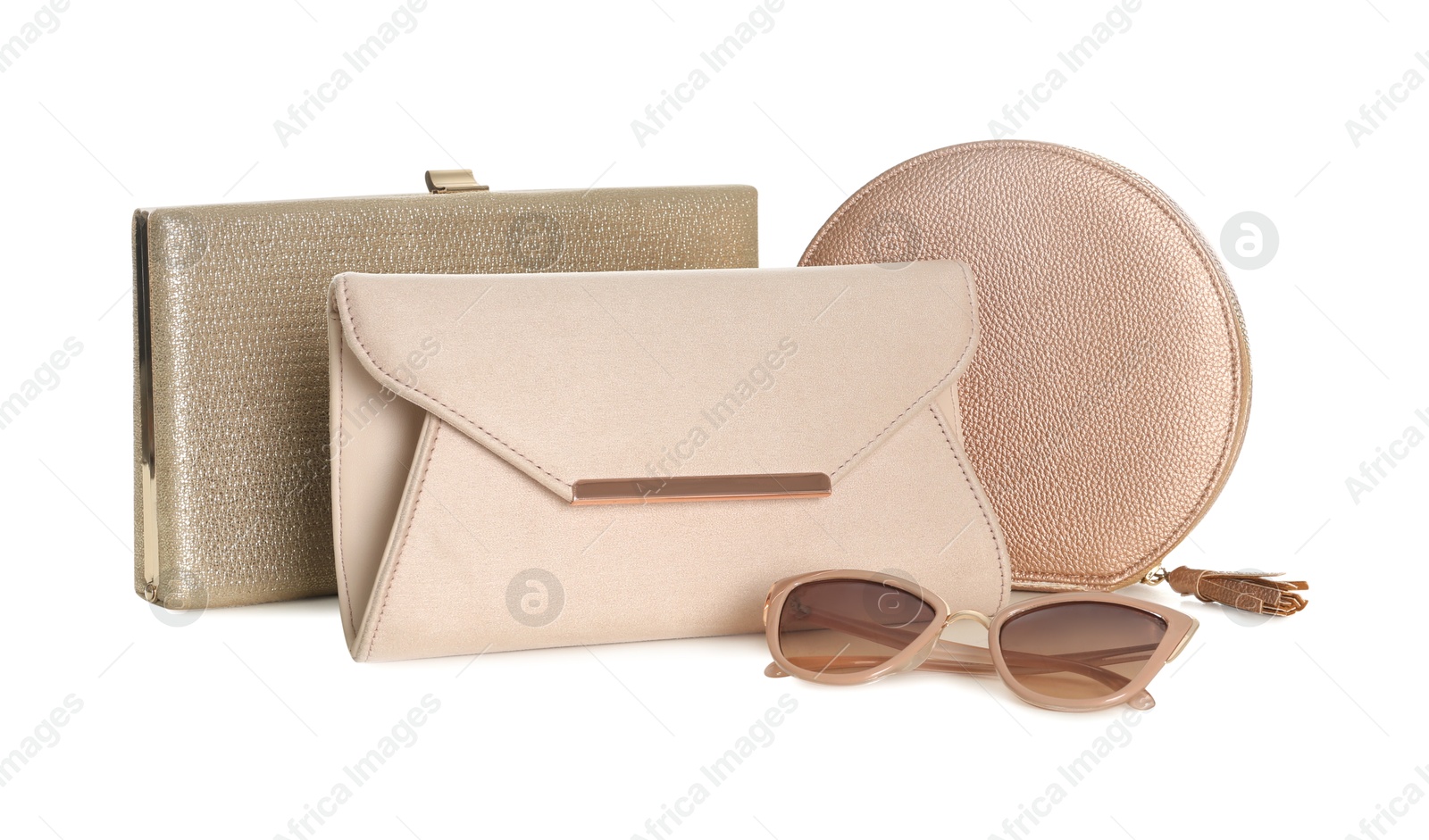 Photo of Different stylish woman's bags and sunglasses isolated on white