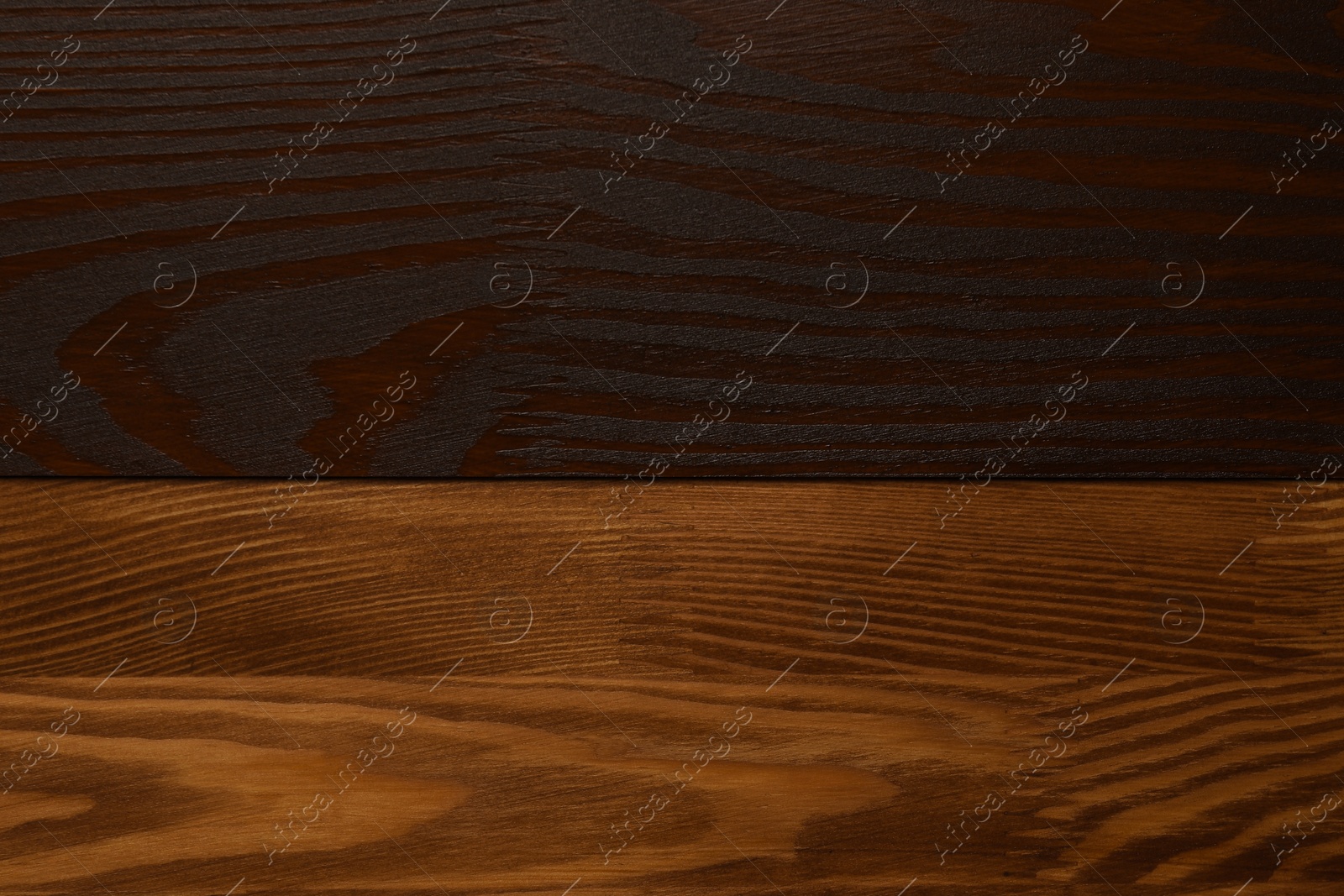 Photo of Applying walnut wood stain. Texture of wooden surface as background, top view