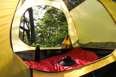 Photo of Modern camping tent in forest at summer, low angle view