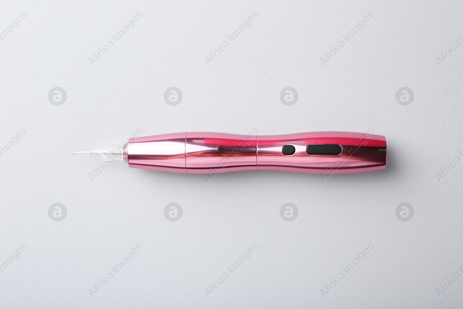 Photo of Professional permanent makeup machine on light grey background, top view