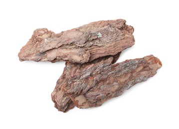 Photo of Pieces of tree bark on white background, top view