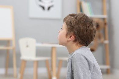 Photo of Autism concept. Lonely little boy at home, space for text