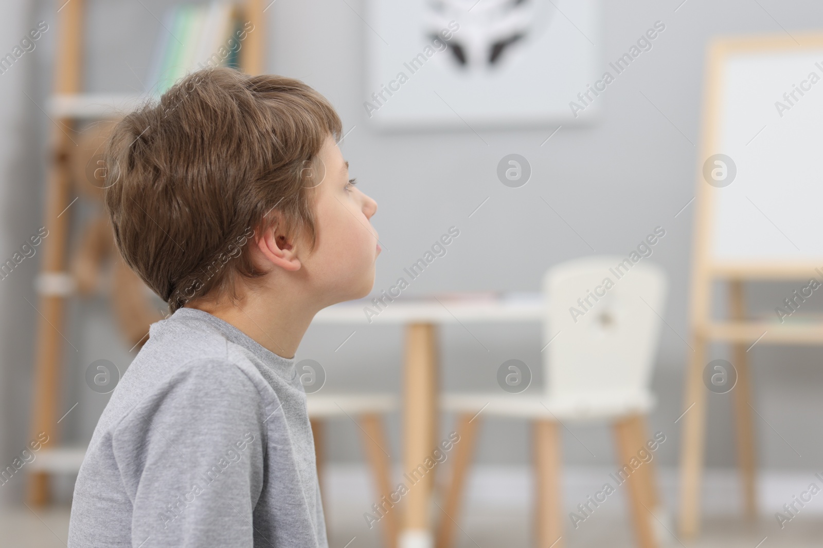 Photo of Autism concept. Lonely little boy at home, space for text