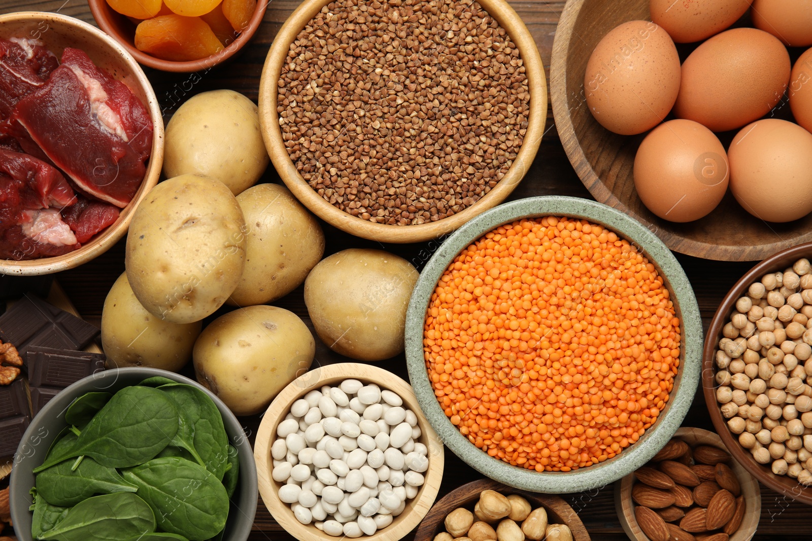 Photo of Different products rich in iron on table, flat lay