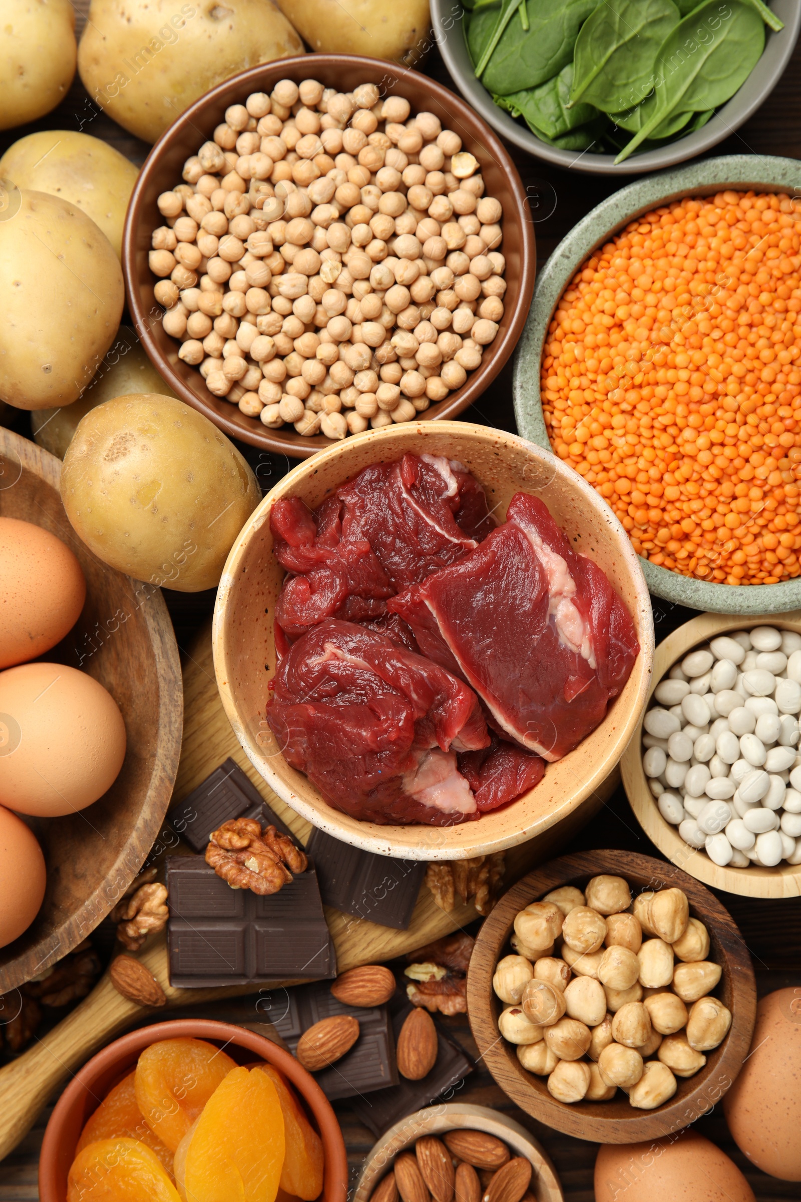 Photo of Different products rich in iron on table, flat lay