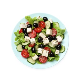 Photo of Delicious salad with feta cheese isolated on white, top view