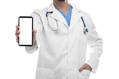 Doctor showing smartphone with blank screen on white background, closeup. Mockup for design