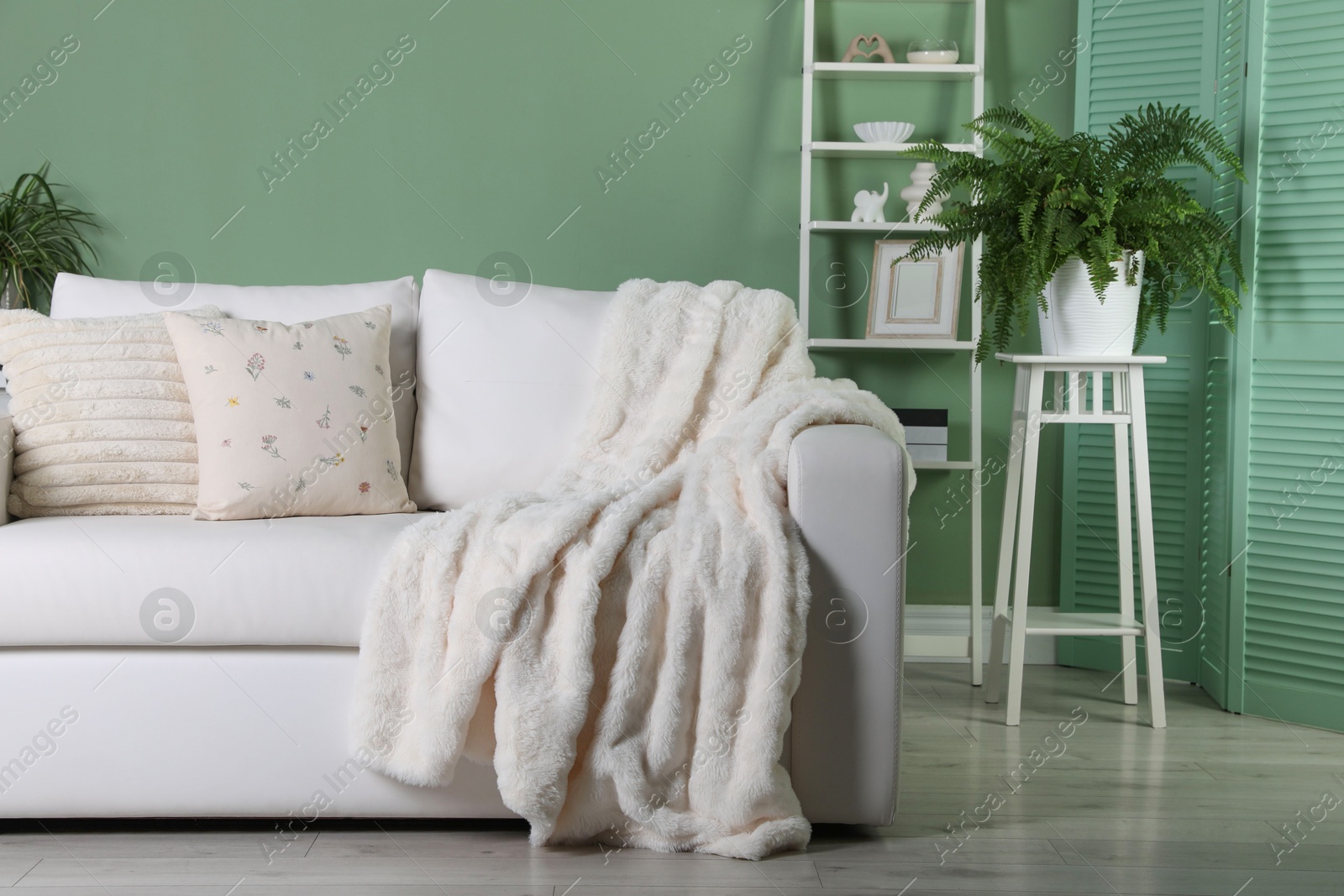 Photo of Beautiful living room interior with cozy sofa