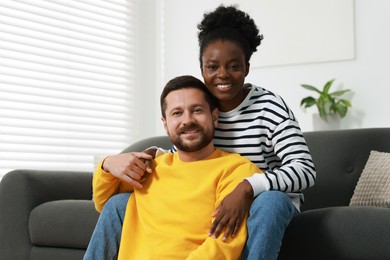 Photo of International relationships. Portrait of lovely couple at home