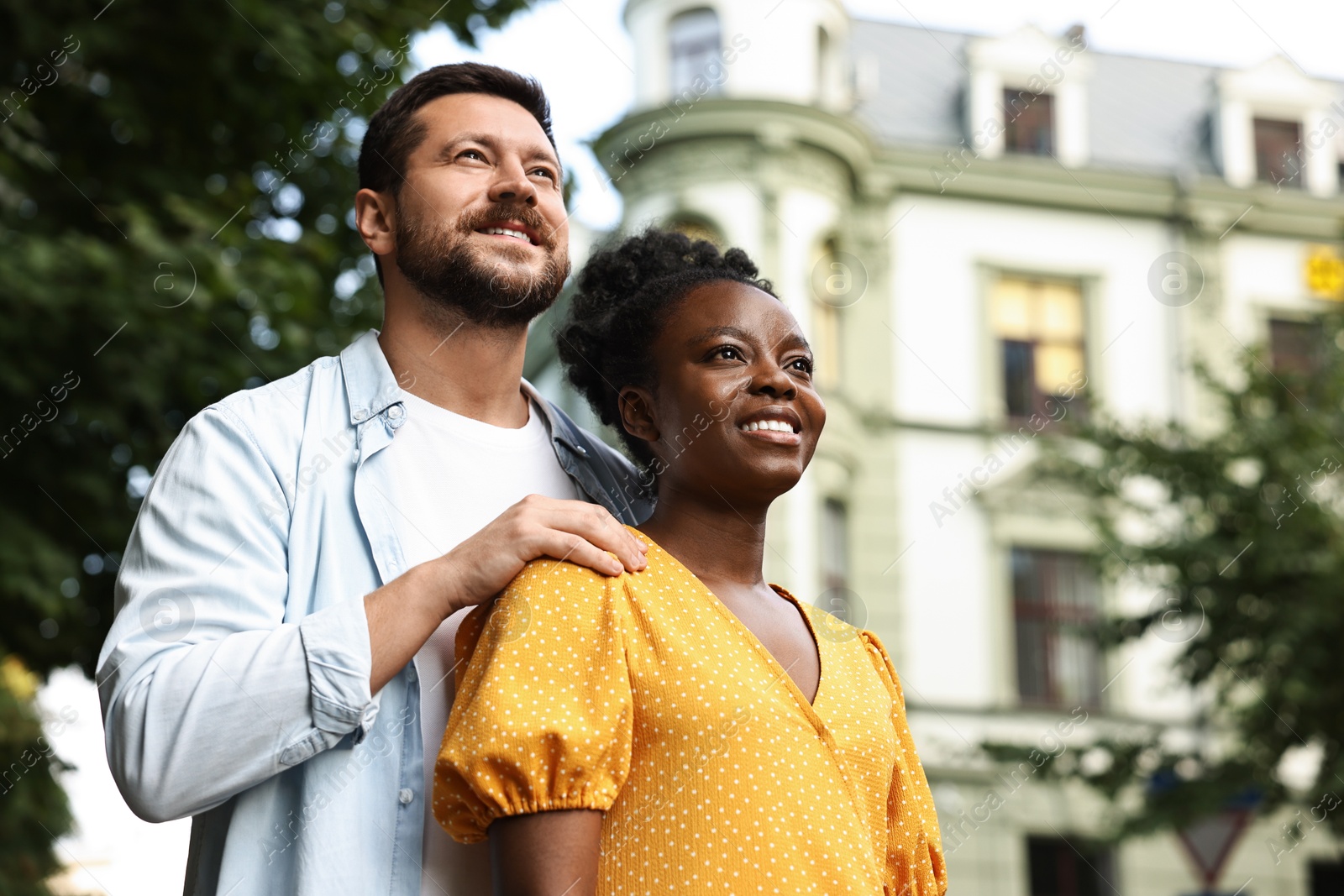 Photo of International relationships. Portrait of lovely couple outdoors, space for text