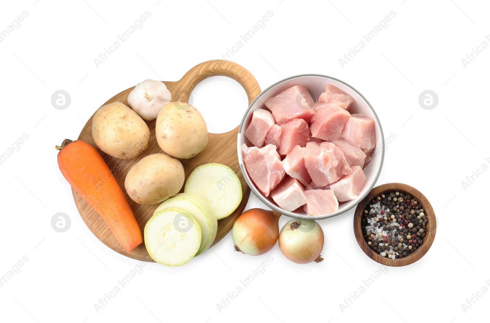 Photo of Uncooked ingredients for stew isolated on white, top view