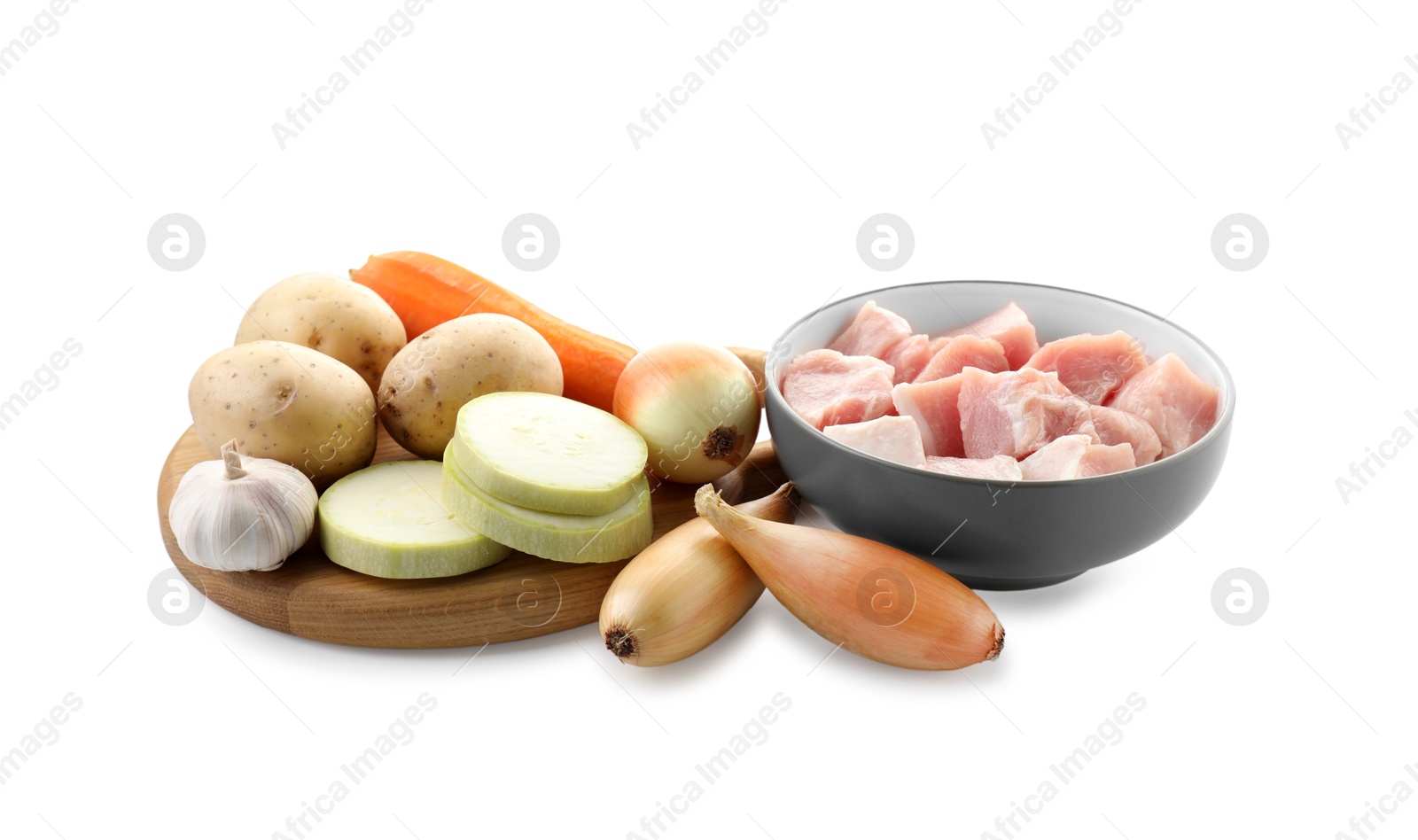 Photo of Uncooked ingredients for stew isolated on white