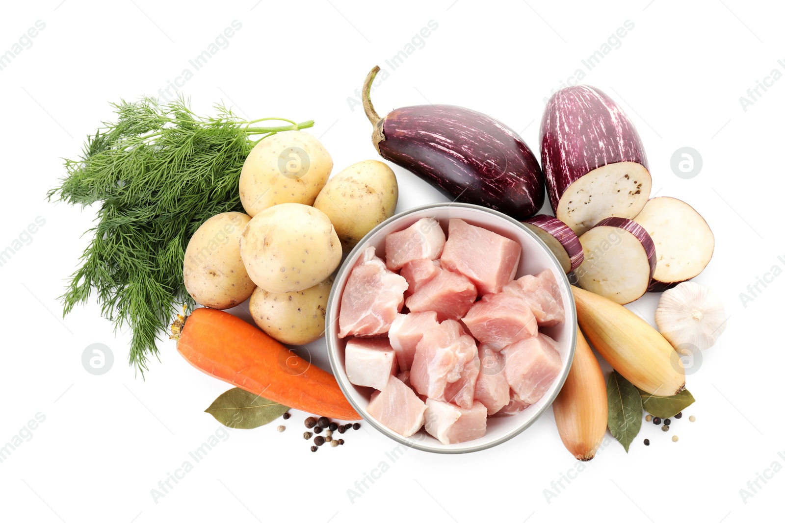 Photo of Uncooked ingredients for stew isolated on white, top view