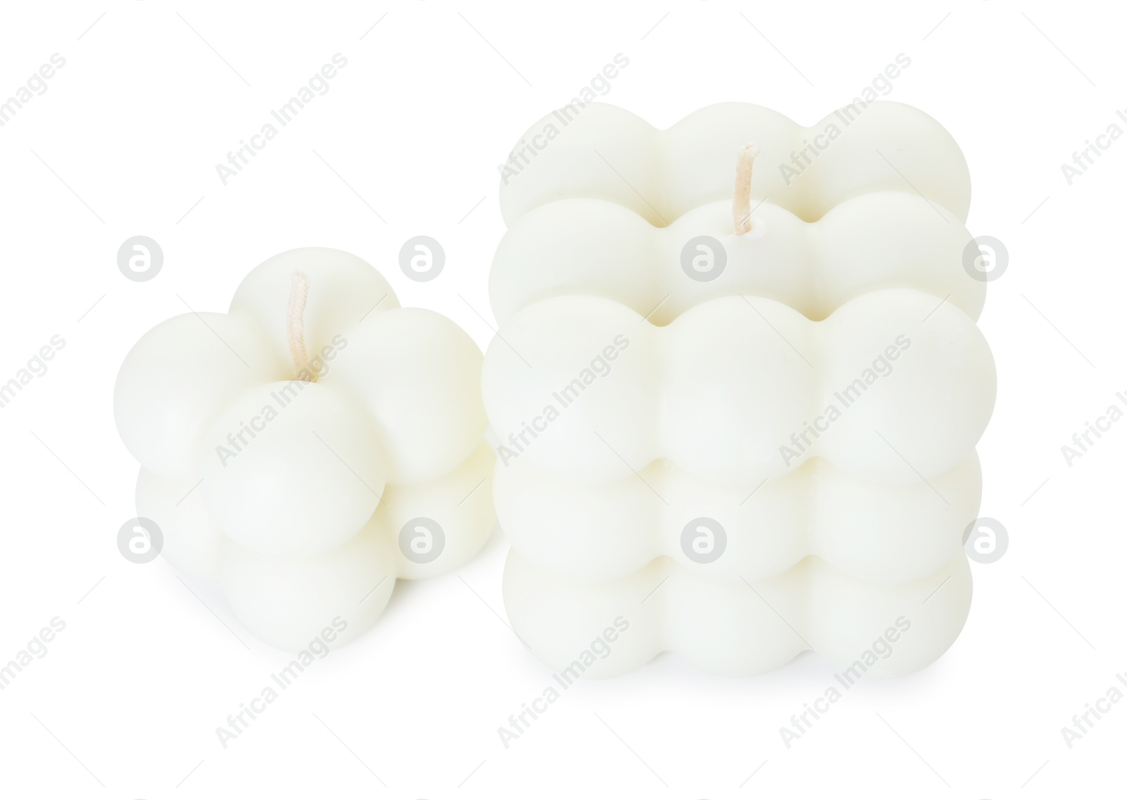 Photo of Two beautiful bubble candles isolated on white