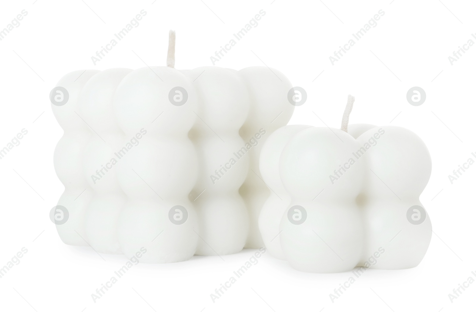 Photo of Two beautiful bubble candles isolated on white