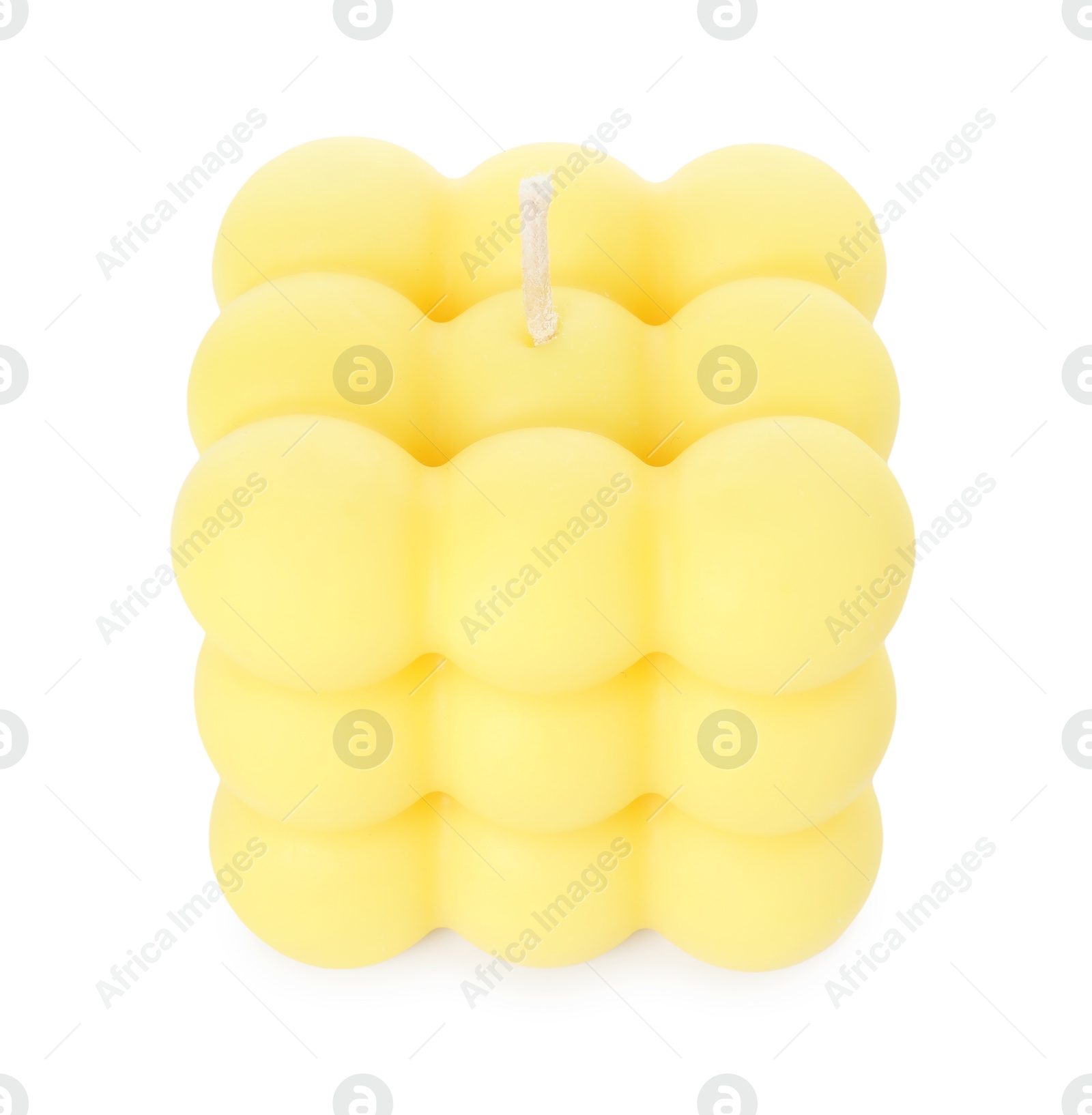 Photo of One yellow bubble candle isolated on white