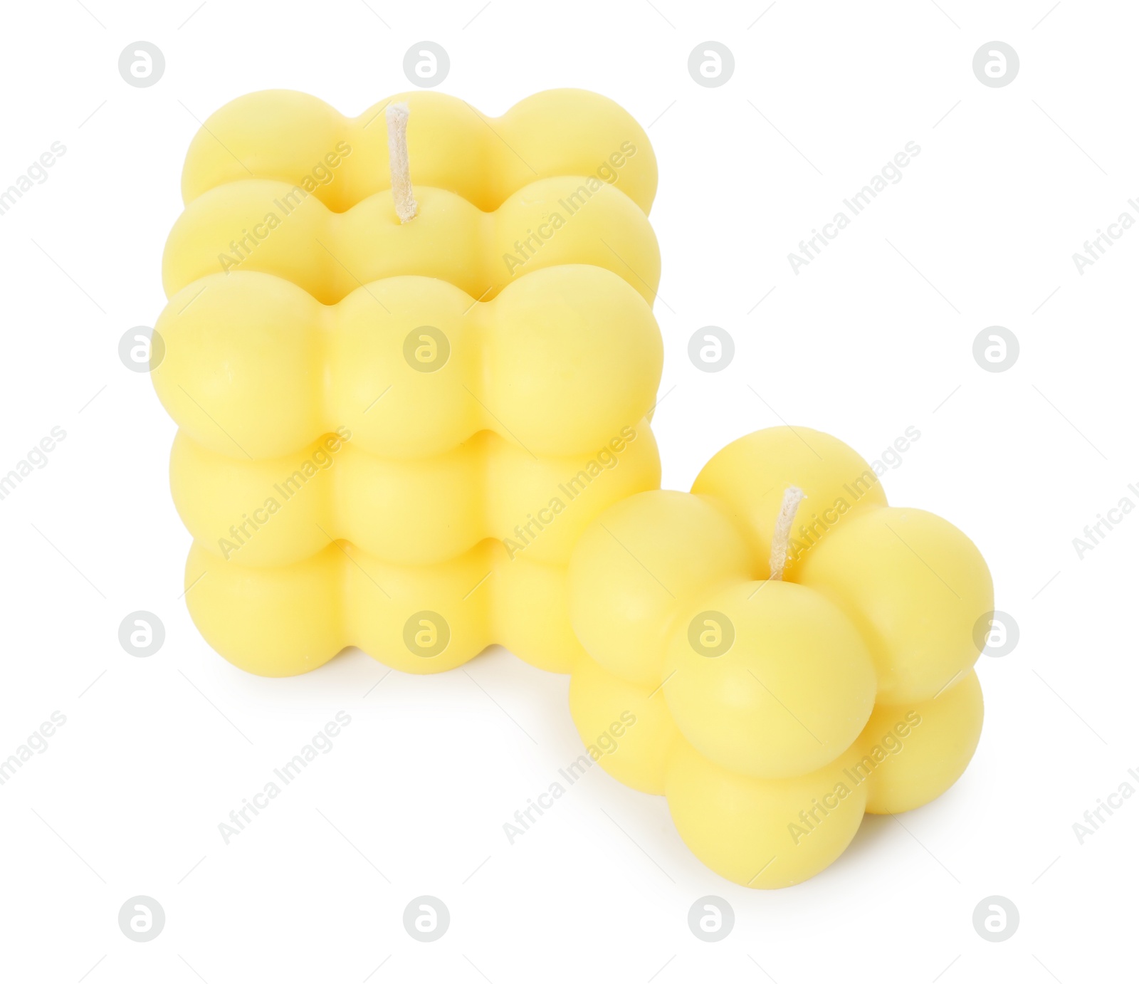 Photo of Two yellow bubble candles isolated on white