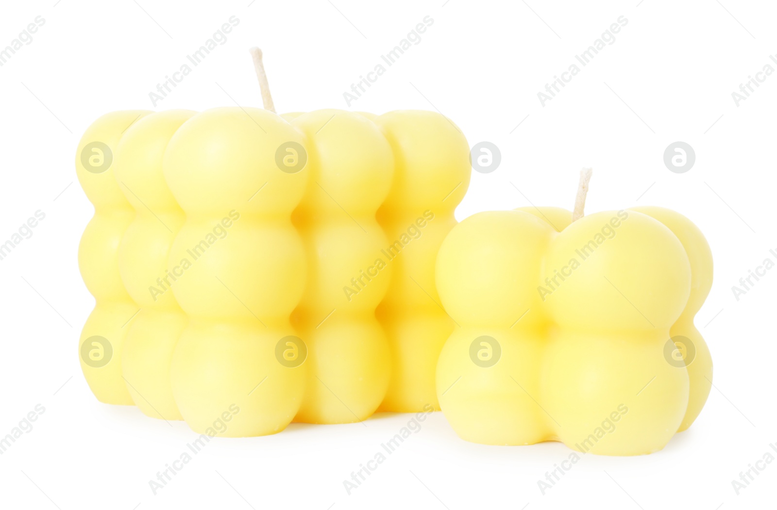 Photo of Two yellow bubble candles isolated on white