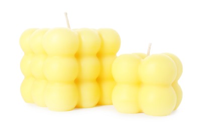 Photo of Two yellow bubble candles isolated on white