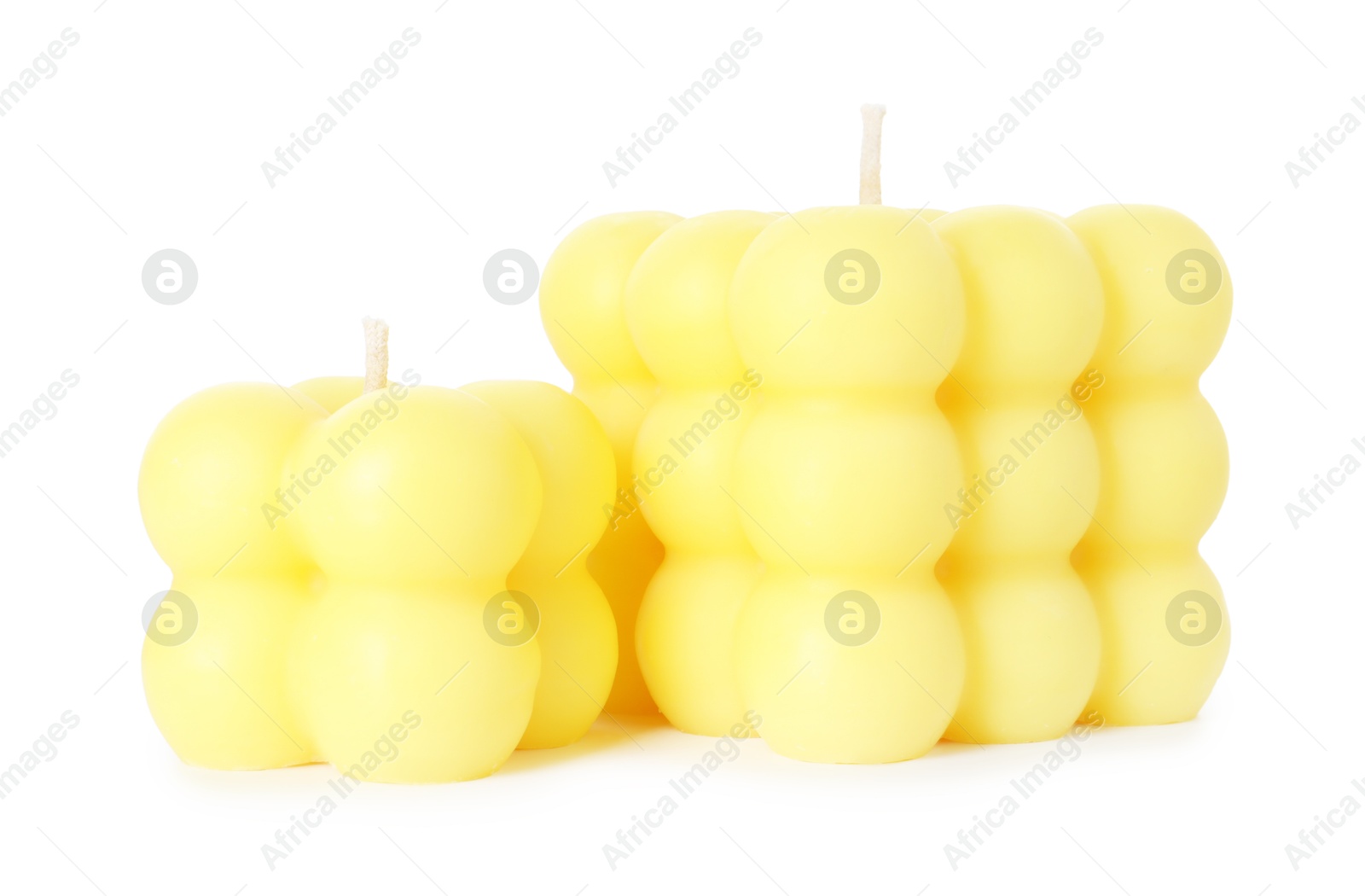 Photo of Two yellow bubble candles isolated on white