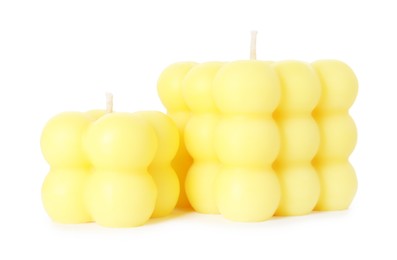 Photo of Two yellow bubble candles isolated on white