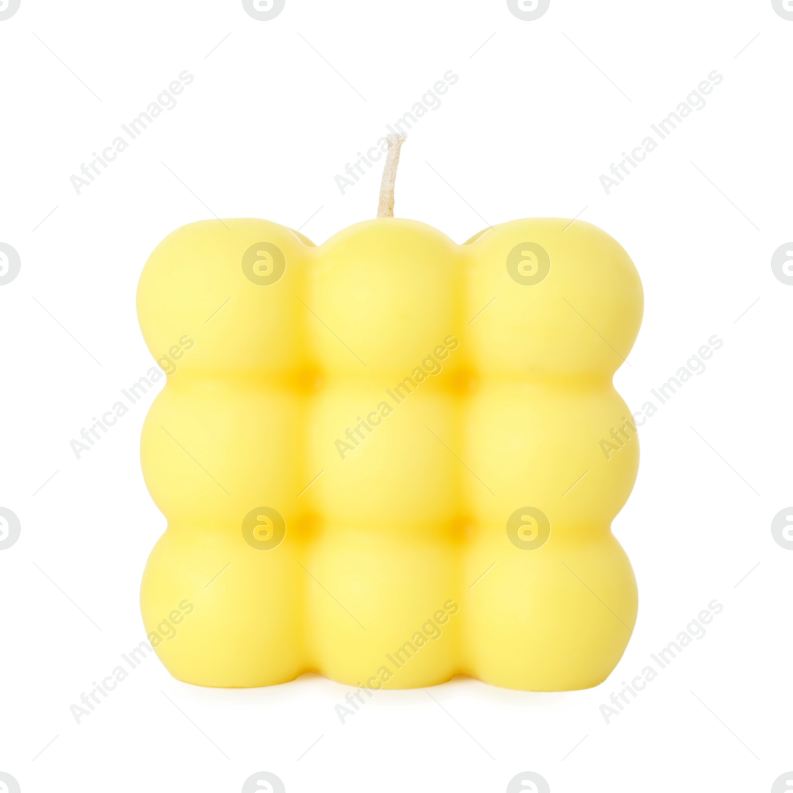 Photo of One yellow bubble candle isolated on white