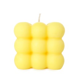 Photo of One yellow bubble candle isolated on white