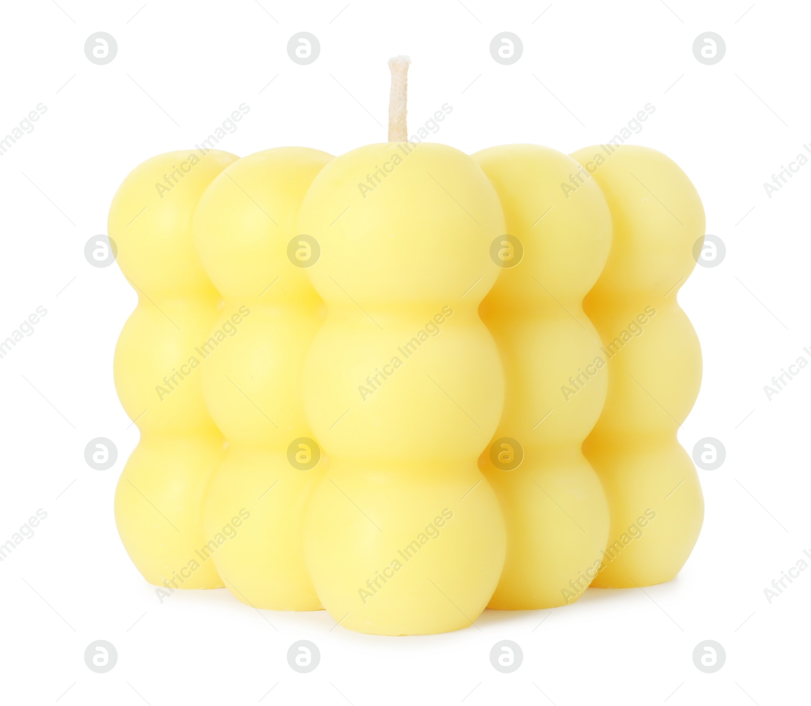 Photo of One yellow bubble candle isolated on white