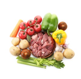 Photo of Cooking stew. Uncooked meat and vegetables isolated on white, top view