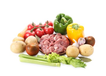 Cooking stew. Uncooked meat and vegetables isolated on white