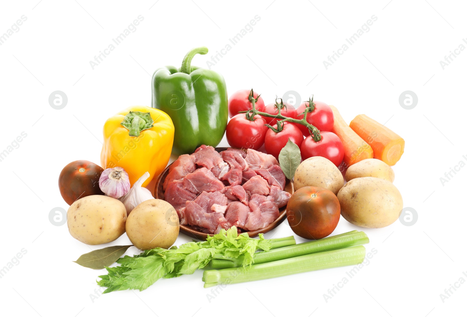 Photo of Cooking stew. Uncooked meat and vegetables isolated on white