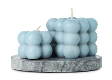 Photo of Beautiful light blue bubble candles isolated on white