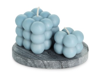 Photo of Beautiful light blue bubble candles isolated on white