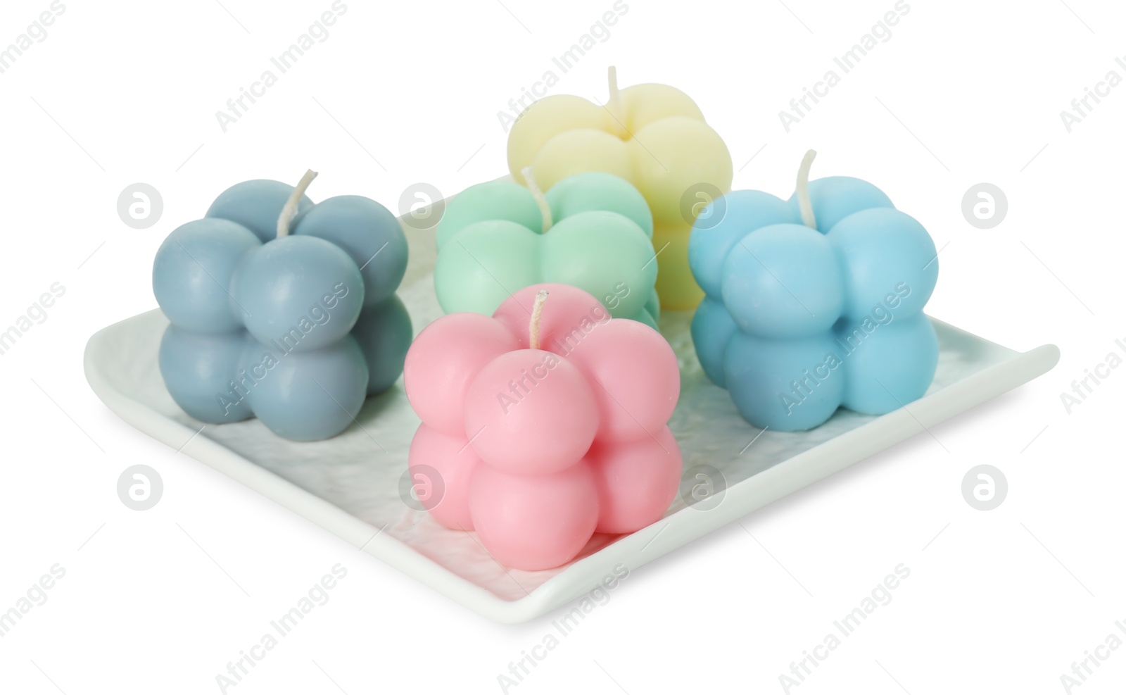 Photo of Many beautiful bubble candles isolated on white