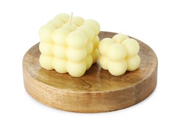 Photo of Beautiful yellow bubble candles isolated on white