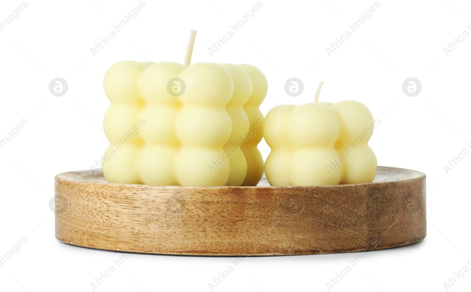 Photo of Beautiful yellow bubble candles isolated on white